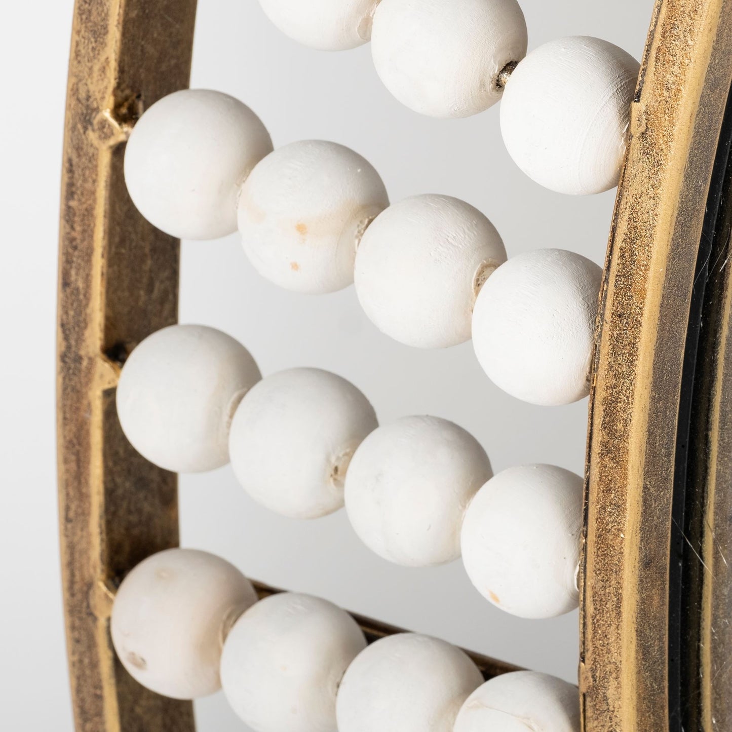 Round Gold Metal Frame Wall Mirror With White Wood Beads