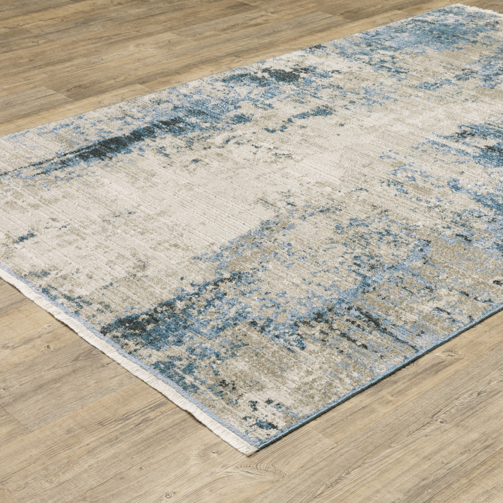 10 x 13 Blue Grey Ivory Light Blue & Dark Blue Power Loom Stain Resistant Rug With Fringe