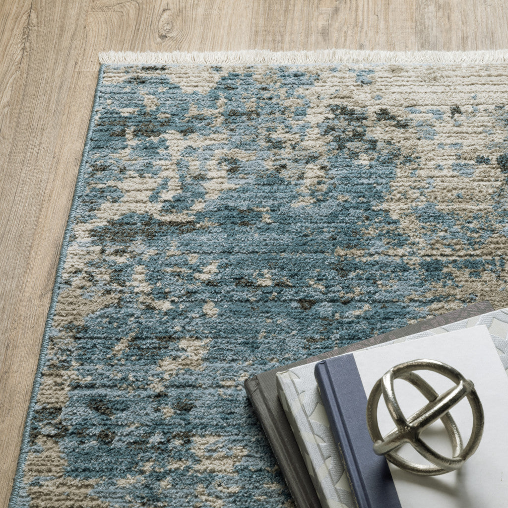 10 x 13 Blue Grey Ivory Light Blue & Dark Blue Power Loom Stain Resistant Rug With Fringe