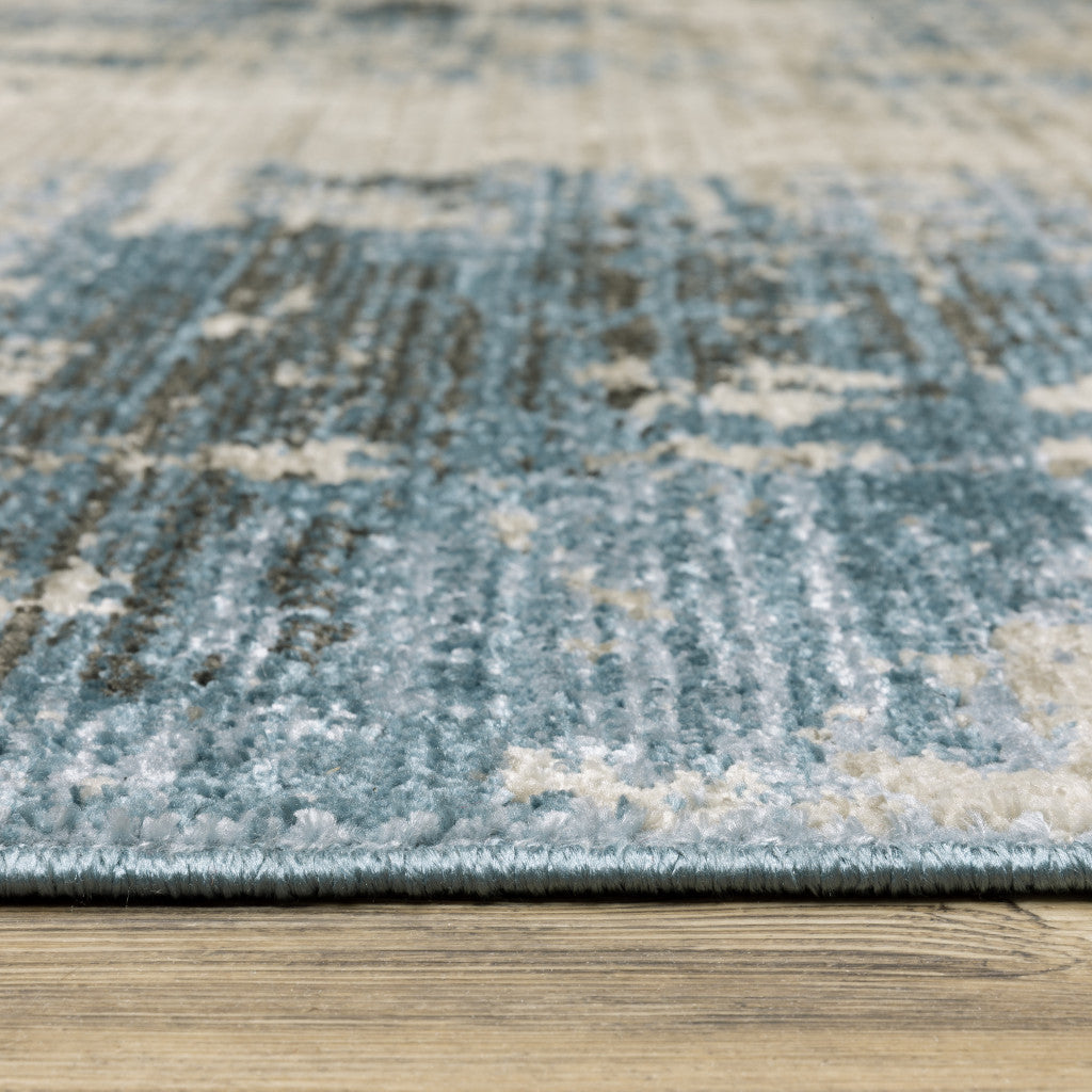 10 x 13 Blue Grey Ivory Light Blue & Dark Blue Power Loom Stain Resistant Rug With Fringe
