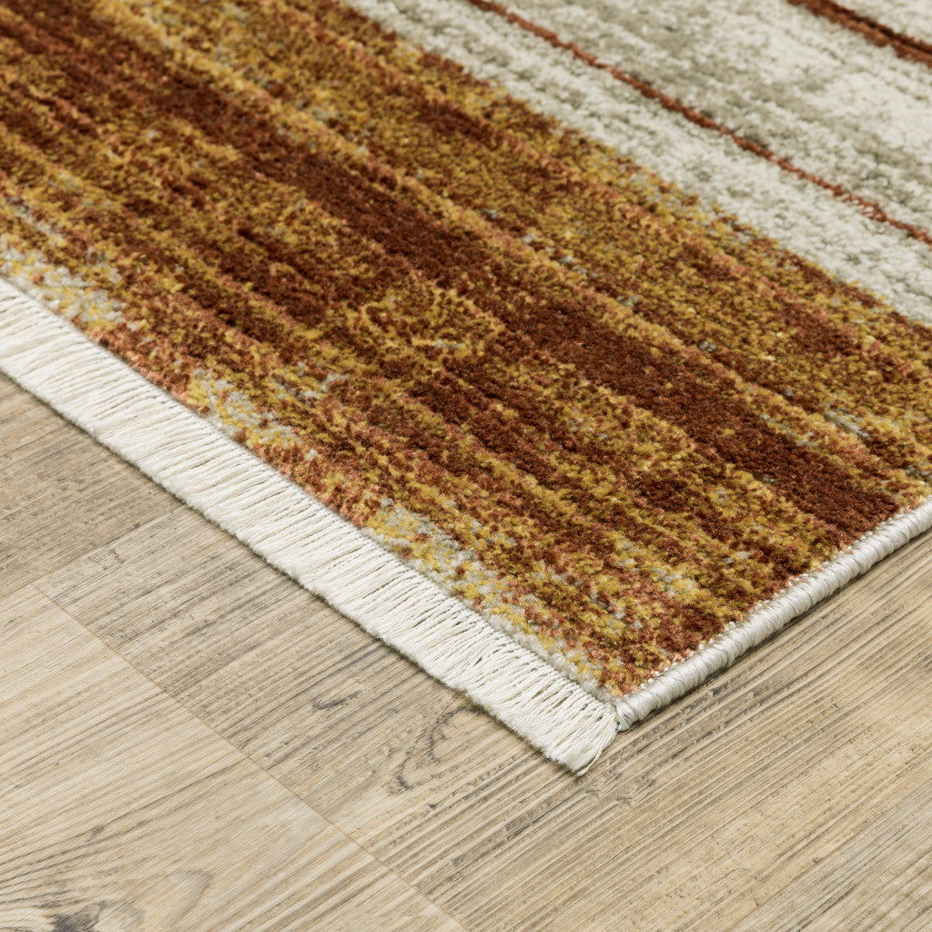 10 x 13 Rust Gold Blue Grey Ivory & Tan Geometric Power Loom Stain Resistant Rug With Fringe