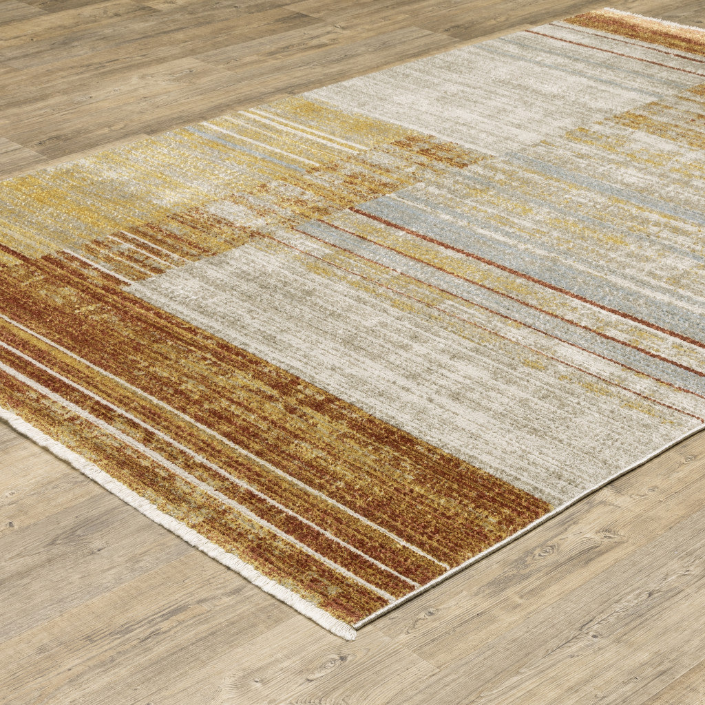 10 x 13 Rust Gold Blue Grey Ivory & Tan Geometric Power Loom Stain Resistant Rug With Fringe