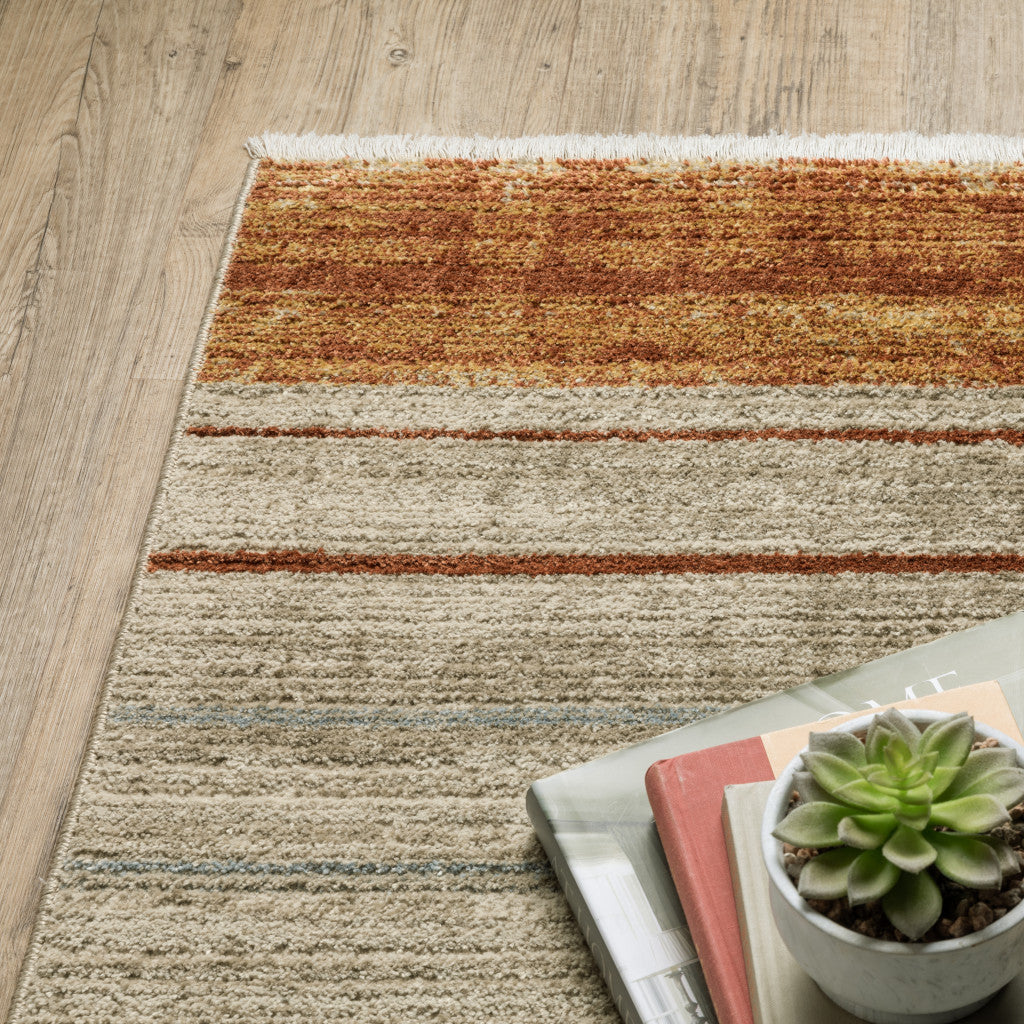 10 x 13 Rust Gold Blue Grey Ivory & Tan Geometric Power Loom Stain Resistant Rug With Fringe