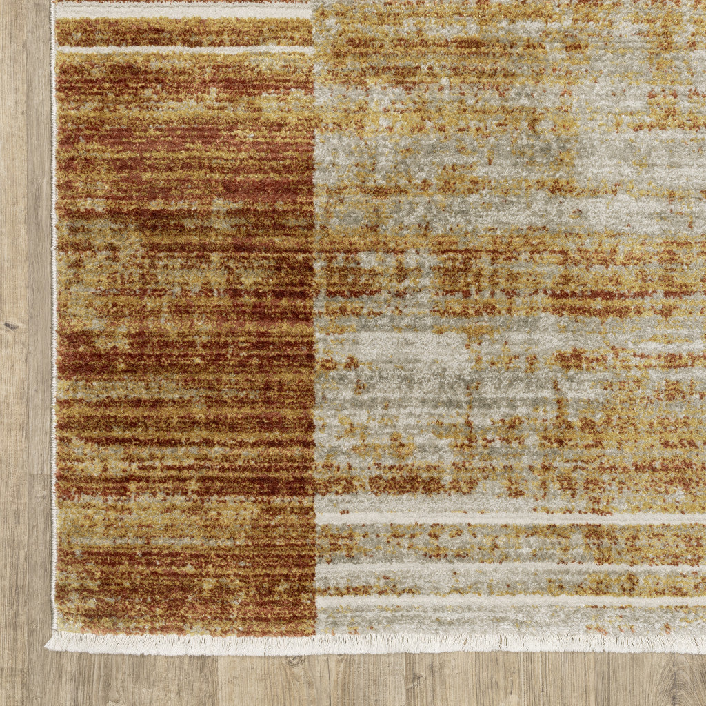 10 x 13 Rust Gold Blue Grey Ivory & Tan Geometric Power Loom Stain Resistant Rug With Fringe
