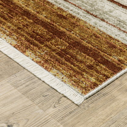 10 x 13 Rust Gold Blue Grey Ivory & Tan Geometric Power Loom Stain Resistant Rug With Fringe