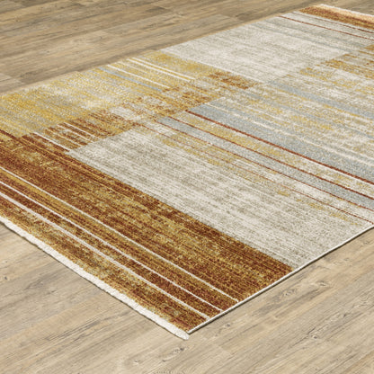 10 x 13 Rust Gold Blue Grey Ivory & Tan Geometric Power Loom Stain Resistant Rug With Fringe