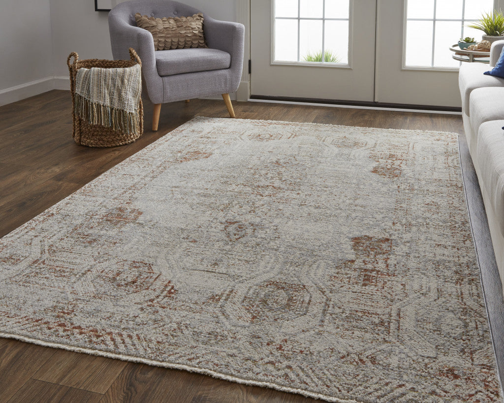 10 x 13 Tan Ivory & Orange Floral Power Loom Distressed Rug With Fringe